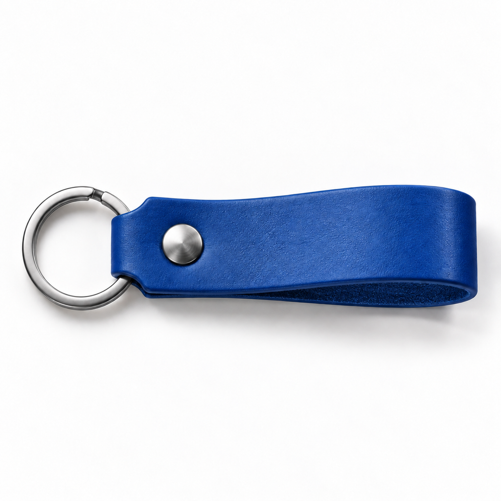 SANTJAG personalized leather keychain in Royal Blue leather, unengraved, with silver-tone key ring and rivet on a white background.