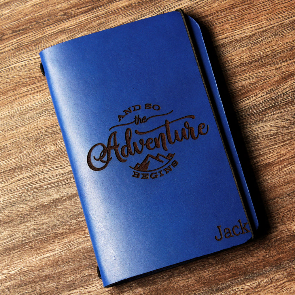 Personalized brown full-grain leather passport cover with laser engraved Vacation Mode On design, elastic band closure, and custom name Nicole engraved at bottom corner.