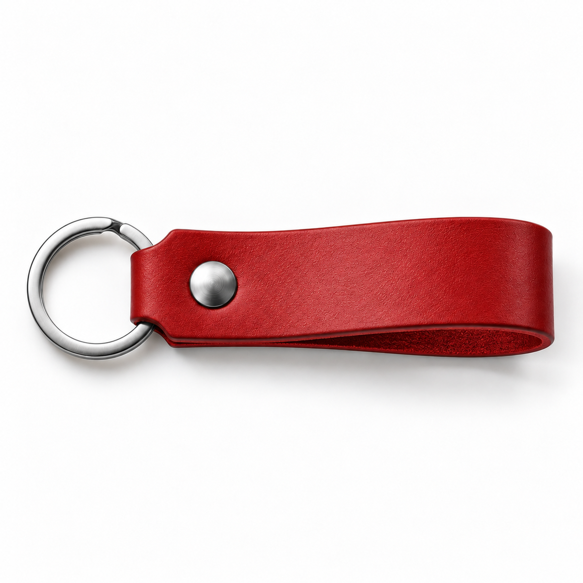 SANTJAG personalized leather keychain in Red leather, unengraved, with silver-tone key ring and rivet on a white background.