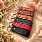 Six SANTJAG personalized leather keychains in different colors, featuring engraved names, GPS coordinates, bridesmaid and groomsmen gifts, and Best Dad EST. 2027, arranged with elegant bridal accessories.