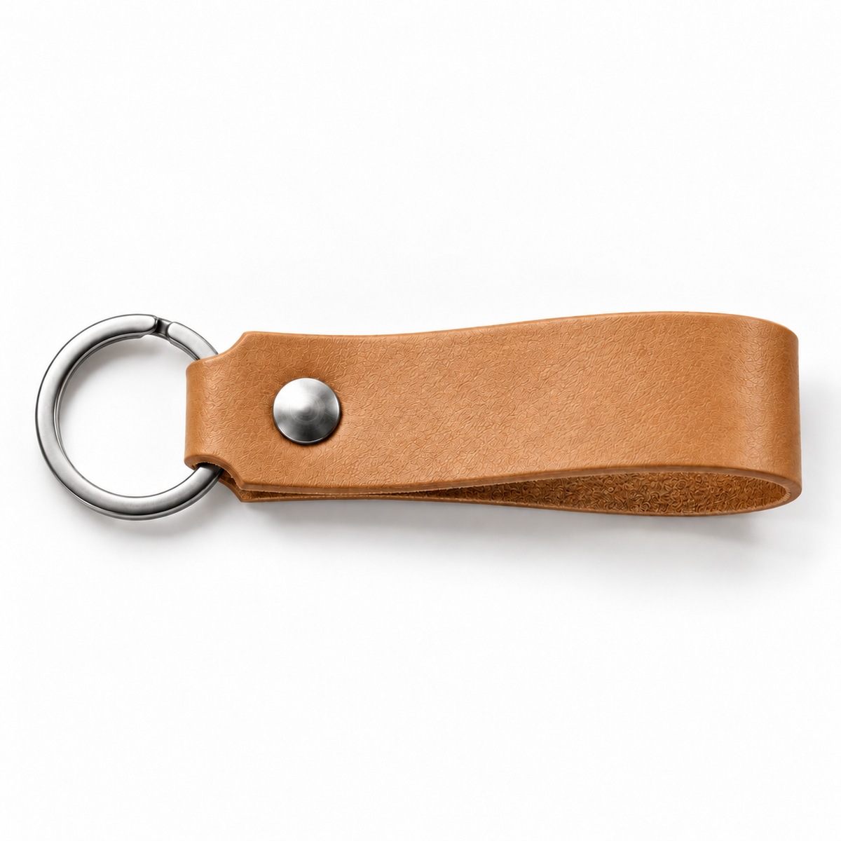 SANTJAG personalized leather keychain in Tan leather, unengraved, with silver-tone key ring and rivet on a white background.
