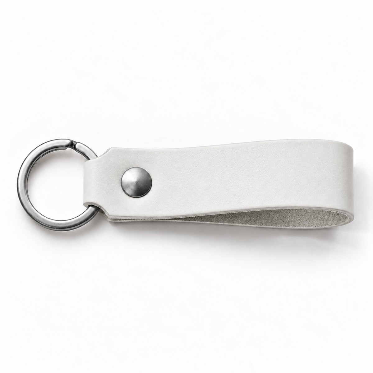 SANTJAG personalized leather keychain in White leather, unengraved, with silver-tone key ring and rivet on a white background.